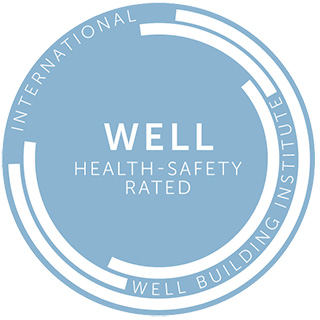 Blue circle WELL logo on white background - WELL Health-Safety Rated - internation Well Building Institute
