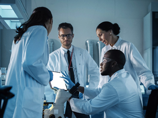 scientists having a discussion in a laboratory