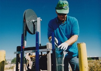 man working on equipment outdoors