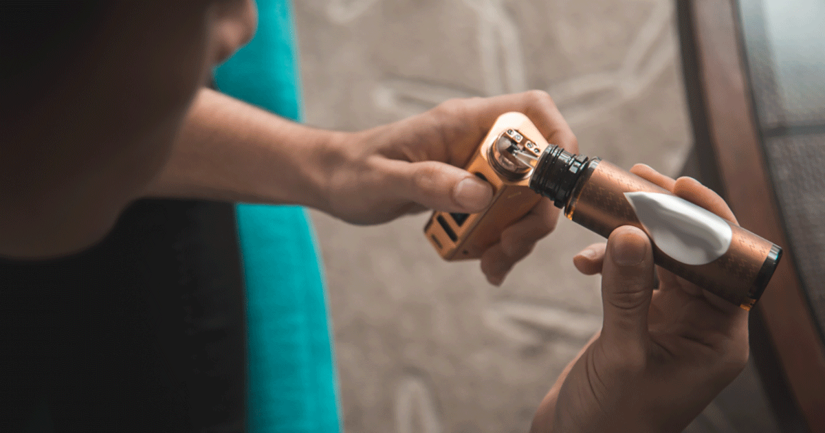 person holding an E-cigarette