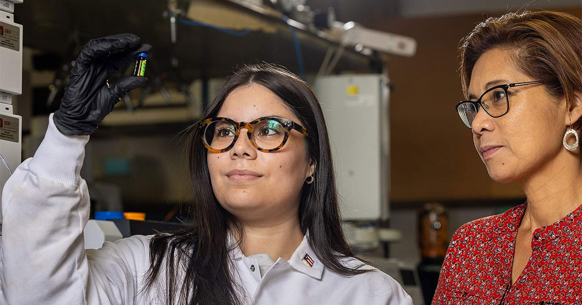 two female scientists in lab looking at samples