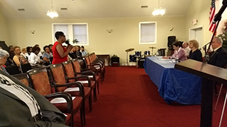 Howarth participates in a town meeting in Chester, Pennsylvania