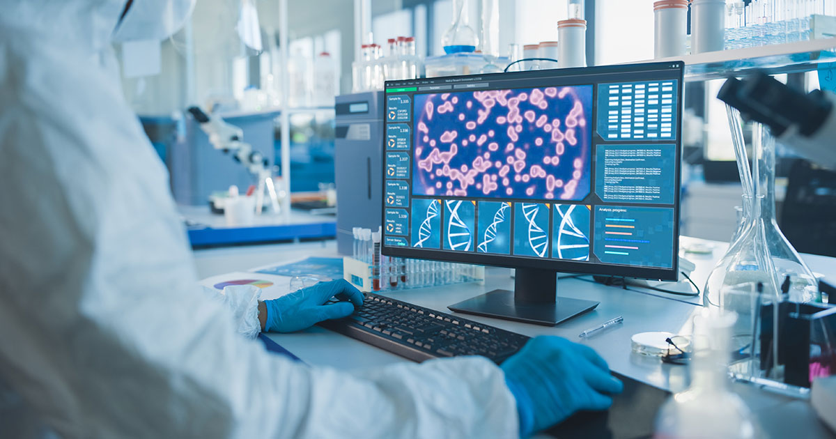 Lab scientist looking at computer details