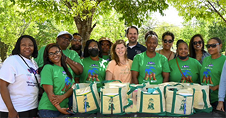 Abby and Nathan Mutic with firneds from the Black Women's Wellness community
