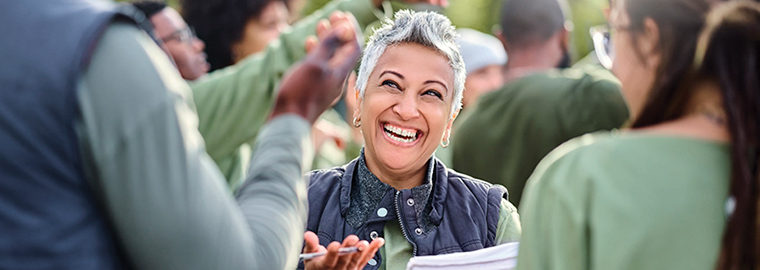 Volunteer, team and people in nature for community service, teamwork and planning with leadership, goals and strategy