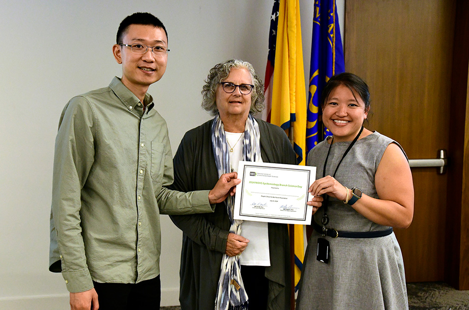 D Chen, D Sandler & J Woo holding an award certificate at the 2024 EB Science Day Awardd