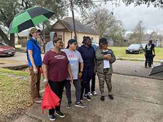 Denae King standing with collaborators from COCO
