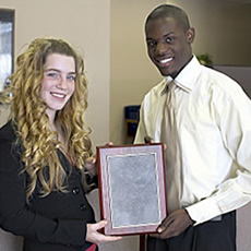 woman and man holding diploma