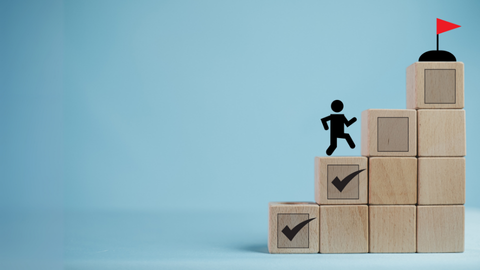 Stick figure climbing wooden blocks