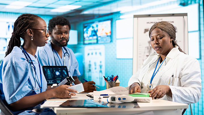 Doctor and nurses standing at a counter