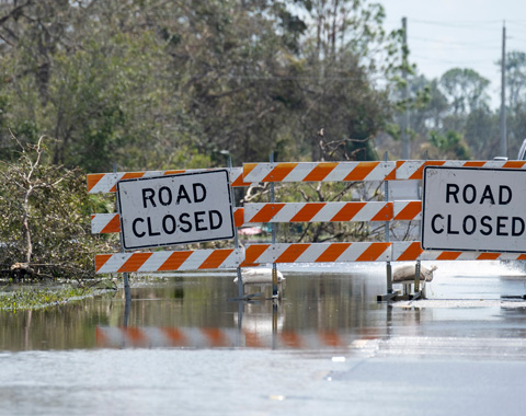 Signs with Road Closed due to water flooding
