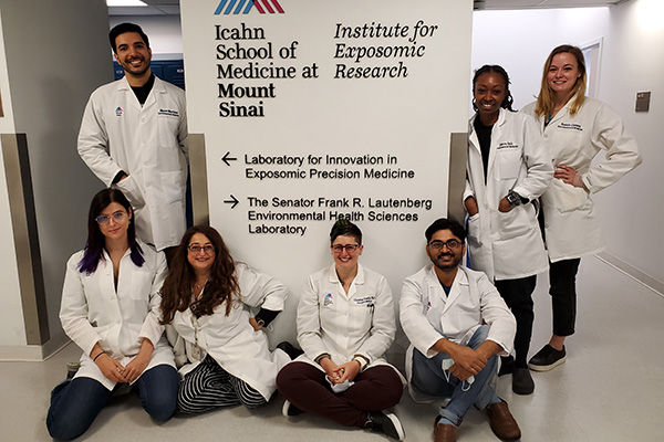 Group of students in white uniforms