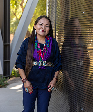 Karletta Chief, Ph.D., standing outside smiling