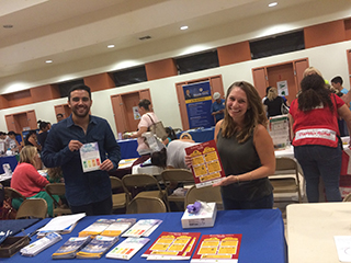 two people present material at a health fair