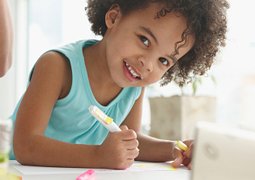 A Little Girl Enjoys Coloring