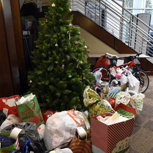 gifts around the tree in the Keystone building