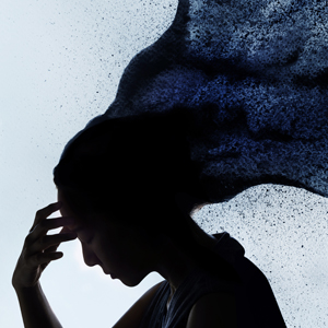 side profile of female with hand on head, looking down, billow of black smoke lifting from her hair