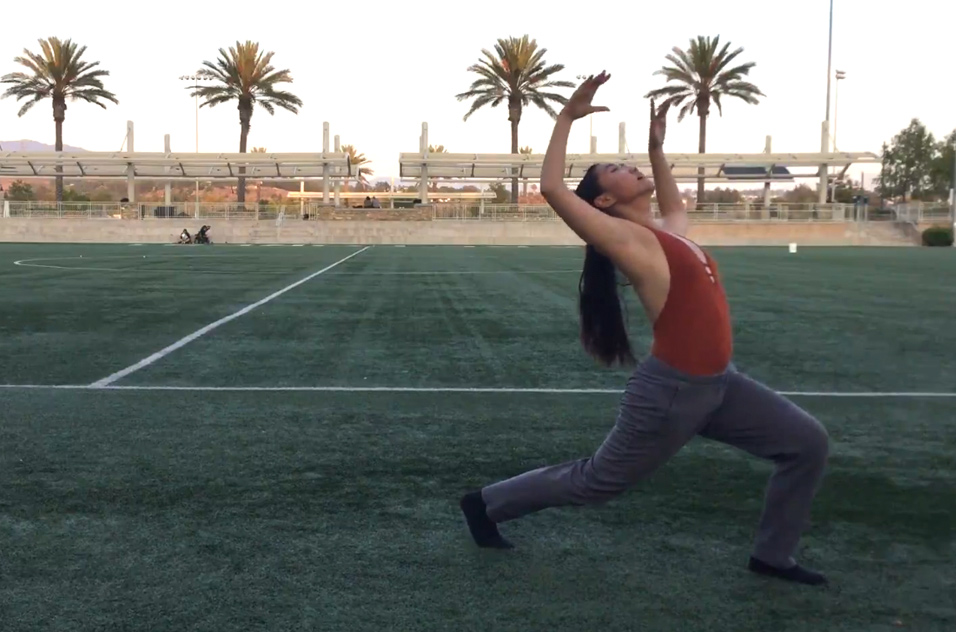 Maggie Li dances in a field
