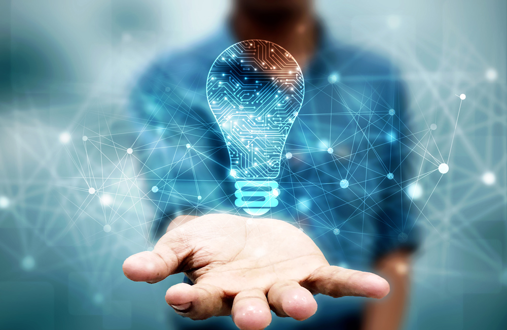 Man with lightbulb floating over his hand