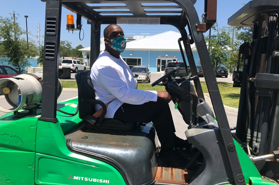 ECWTP trainee sits in forklift during training