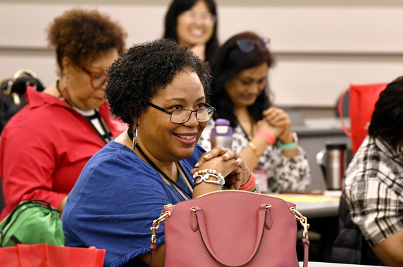 Women sitting in the audience at the conference
