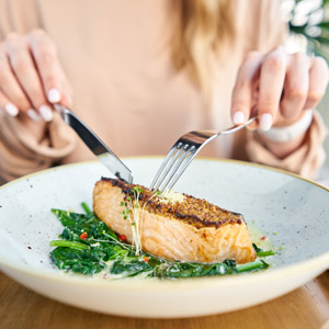 Woman eating fish