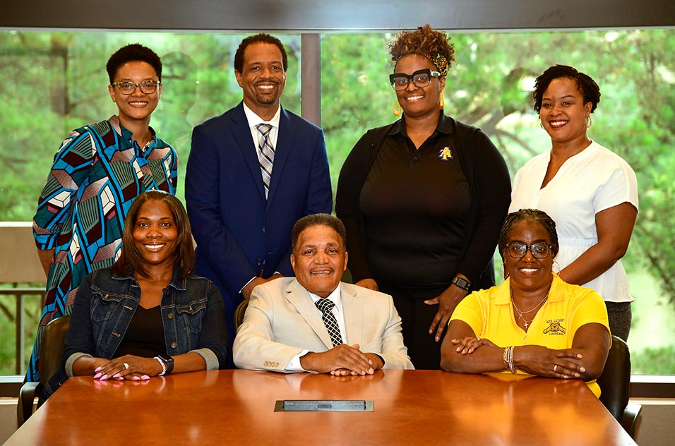 Left to right seated in front row, Erika Hayes, Hanner, and Veronica Robinson; and left to right standing back row, Beth Perry, Coble, Shawn Jeter, and Cyrena Silvera.