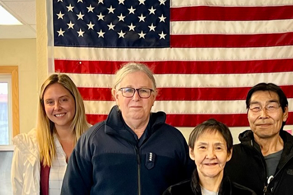 Pamela Miller, second from left, Viola “Vi” Waghiyi, environmental health and justice program director for ACAT, far right, and members of the Native Village of Savoonga shared contamination and climate concerns with Adm. Levine Aug.7. (Photo courtesy of Kim Seigfreid / HHS). 