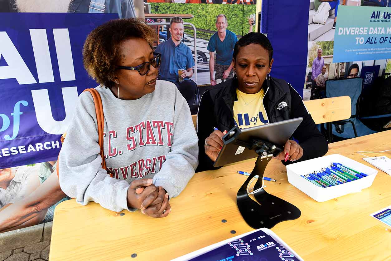 Andrea Davis worked with the All of Us Research Program representatives to sign up as a study volunteer. (Photo courtesy of Steve McCaw / NIEHS)