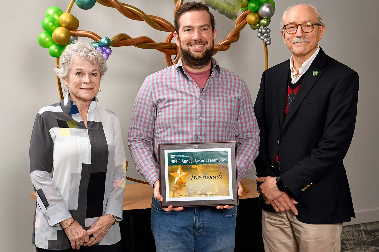 Janet Hall, M.D., left, Justin Kosak, center, and Rick Woychik, Ph.D., right