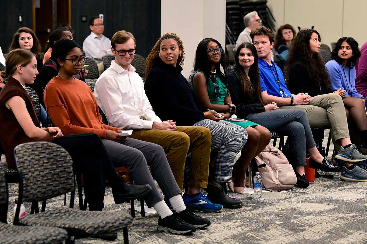 Janell Odom, fifth from left, and Neha Palle, far right, tied for best presenters at the Scholars Connect Program fall event.
