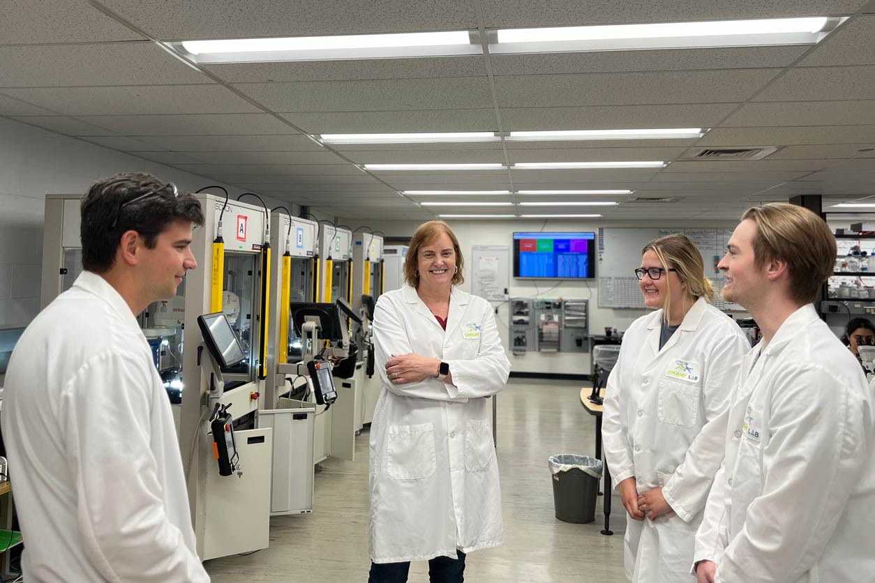 Tanguay and Ph.D. students Dante Perone, Annika Gehl, and Spencer Stinson discuss research strategies. (Photo courtesy of Robyn Tanguay)