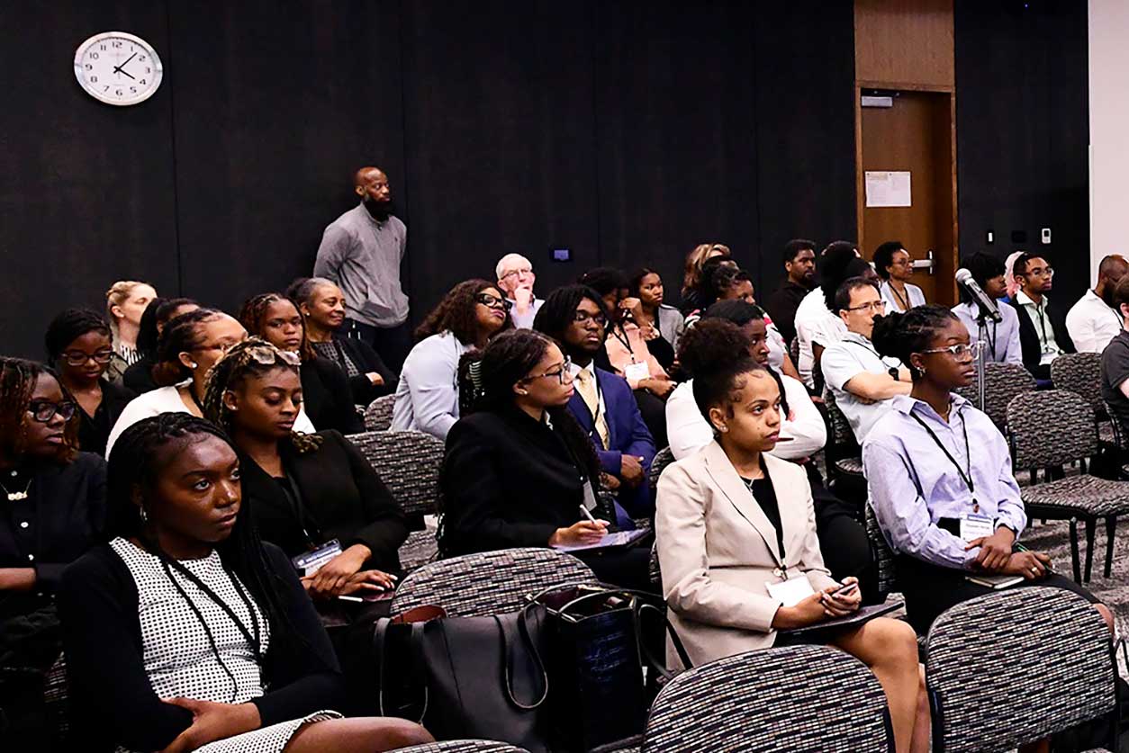 Students from North Carolina HBCUs sit in conference room during NIEHS Scholars Connect Program Annual Symposium