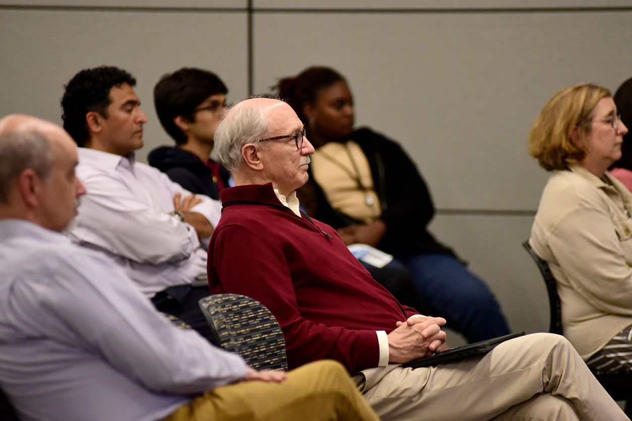 Rick Woychik, Ph.D., center