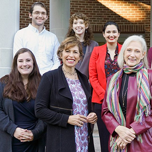 Maria Savasta-Kennedy, J.D., center left in front; collaborating litigator, Cathy Cralle Jones, J.D., center right in front; and UNC law students 