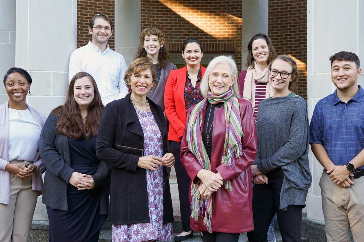 Maria Savasta-Kennedy, J.D., center left in front; collaborating litigator, Cathy Cralle Jones, J.D., center right in front; and UNC law students 