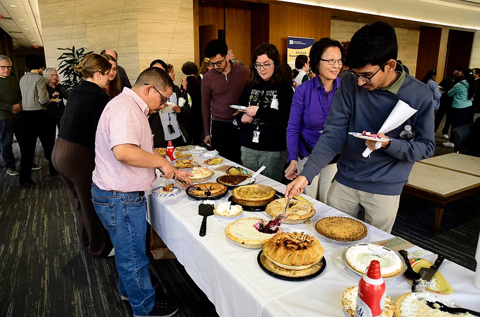“Pi Day” participants and attendees enjoyed a large selection of pies as judges made their decision