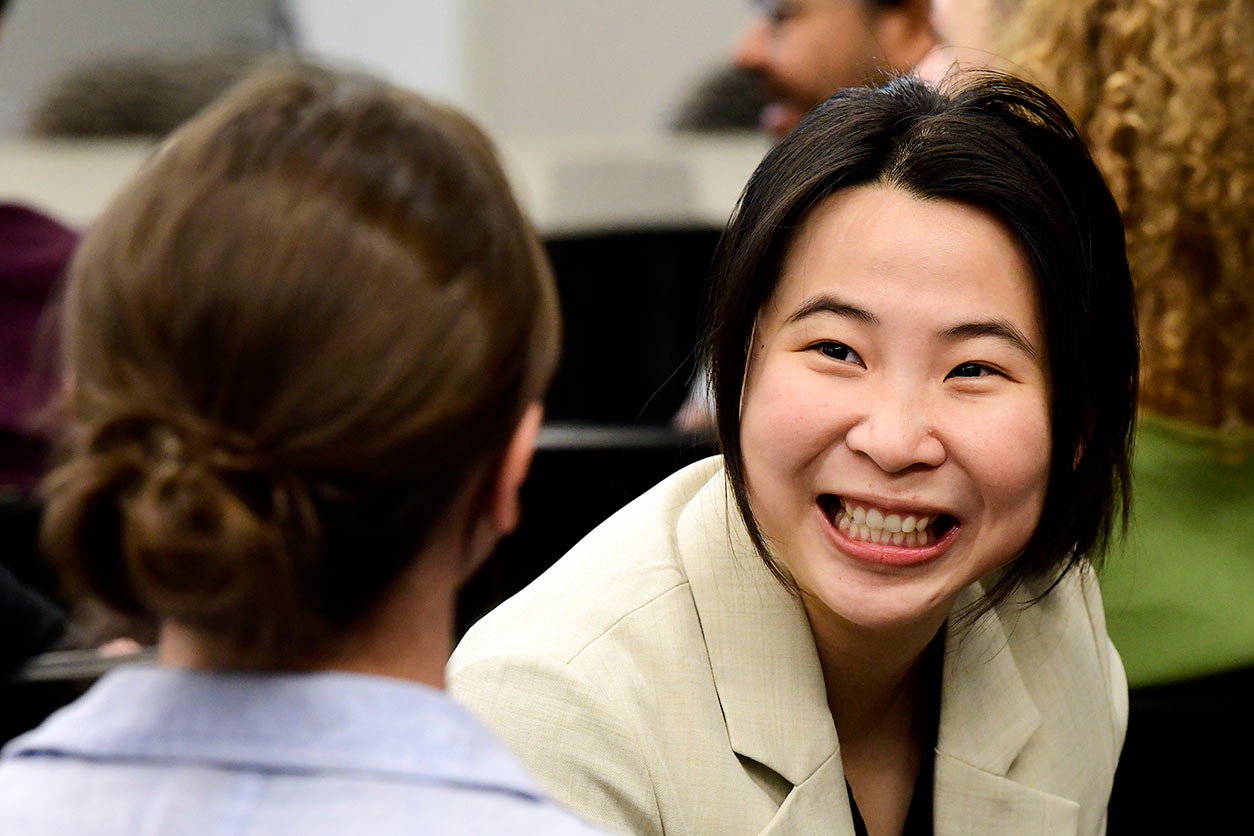 Asian woman introducing herself to another workshop attendee