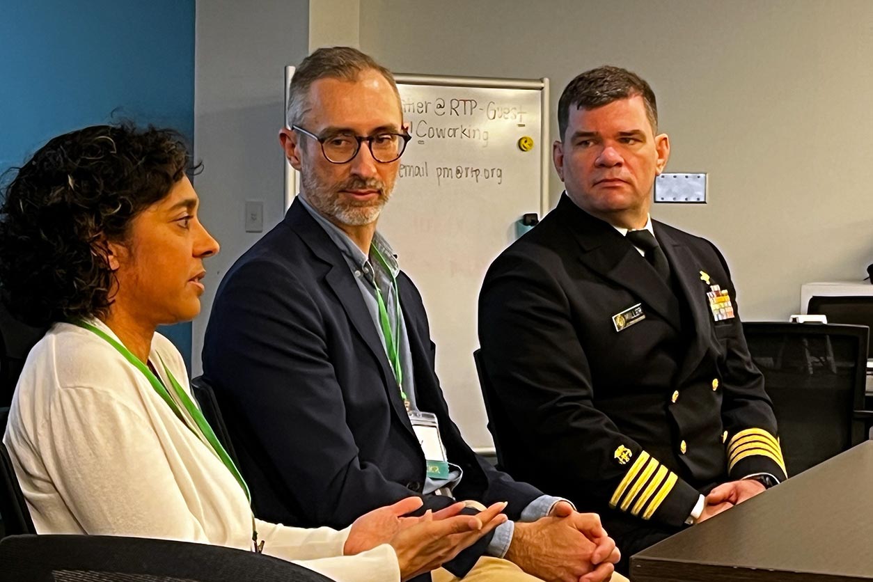 Neepa Choksi, Ph.D., left, John Rooney, Ph.D., middle, and Capt. Mark Miller, Ph.D., right,