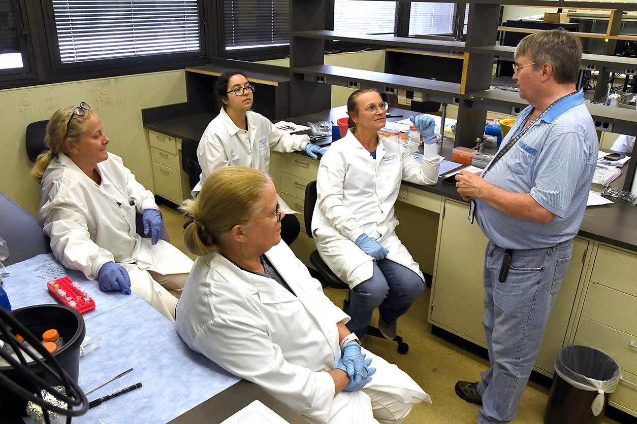 NIEHS scientist Robert Petrovich, Ph.D., discussed DNA gel electrophoresis with teachers during a session in the laboratory. (Photo courtesy of Steve McCaw / NIEHS)