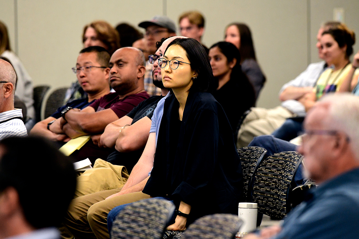Multiple audience members at Merad's presentation
