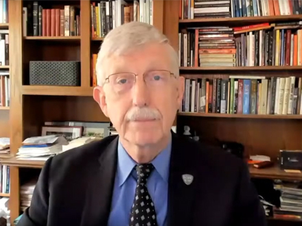 Francis Collins sitting in front of a bookcase