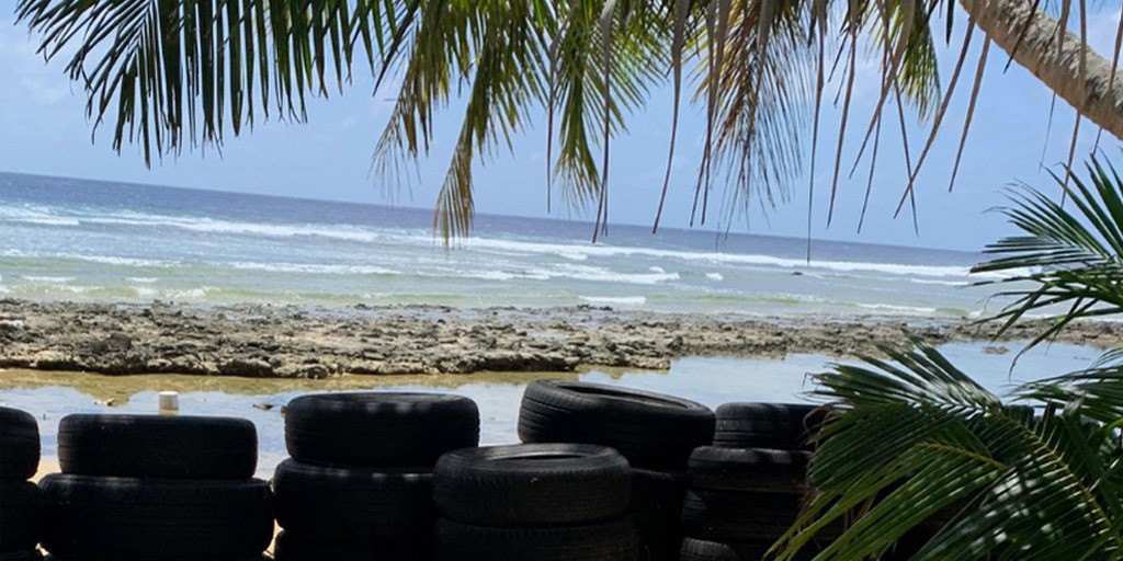 wall of tires on a beach