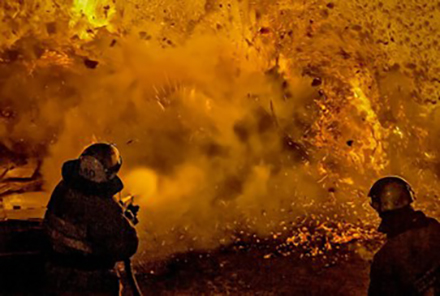 firefighters attempting to extinguish a large blaze of fire