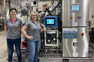 Wang and Kay in front of PFAS destruction unit