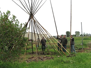 OSU trainees assisting with building a tipi