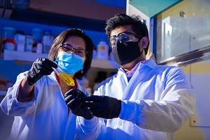 Aga and postdoctoral researcher Utsav Thapa, Ph.D., working in a lab