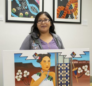 Mallery posing in front of her art