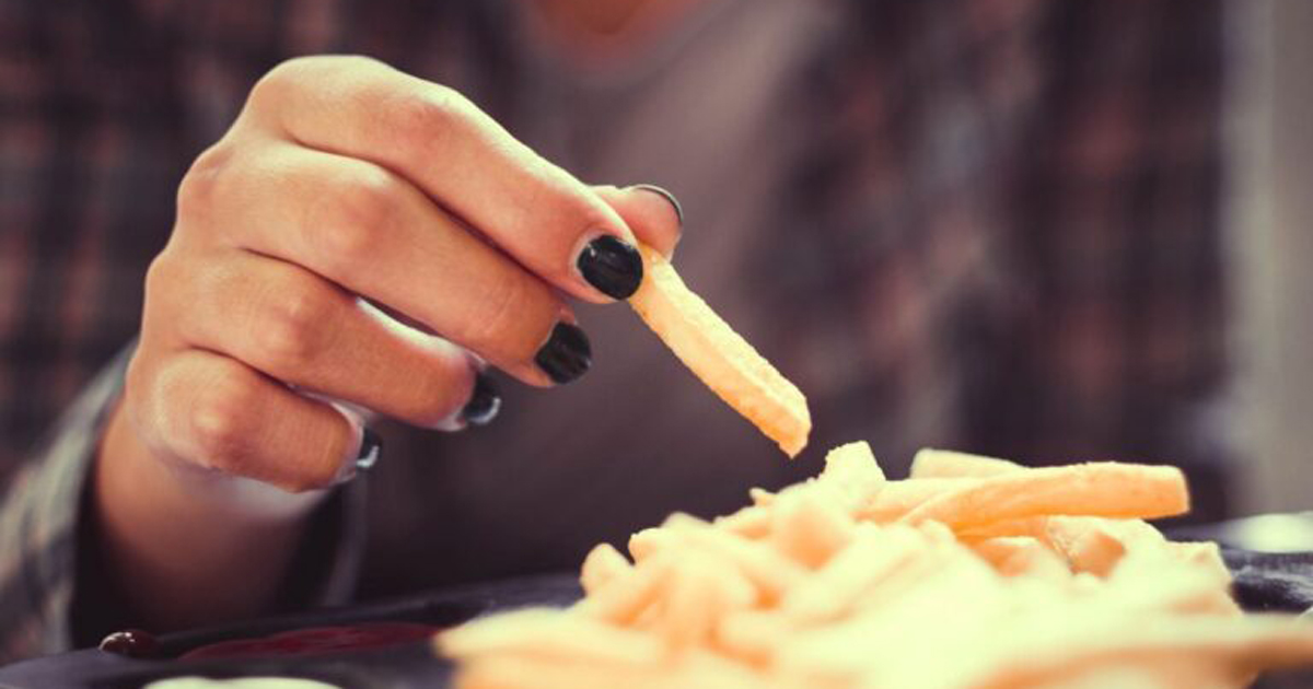 person eating french fries