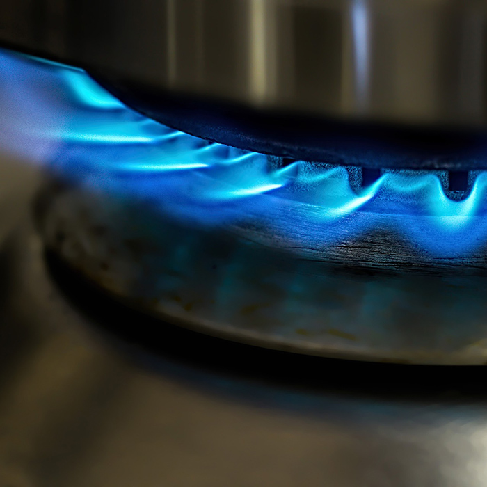 blue flames coming from gas burner